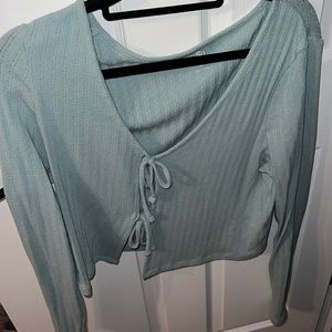 Open tie teal sweater